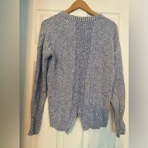 Banana republic brand sweater in XS size with back cut details.